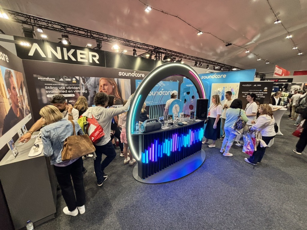 Visitors interacting with soundcore products at the Stockholm Marathon expo